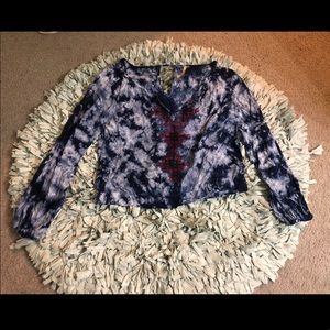 Embroider front detail, peep whole in the back